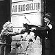 A cat being returned to its owner by an air-raid warden, London, November 1940 (copyright IWM, used with permission) - click to enlarge