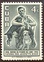 Cuba, 1957: Band of Charity 50th anniversary - boy with cat and puppies