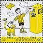 Germany, 2007: boy and cat posting letter